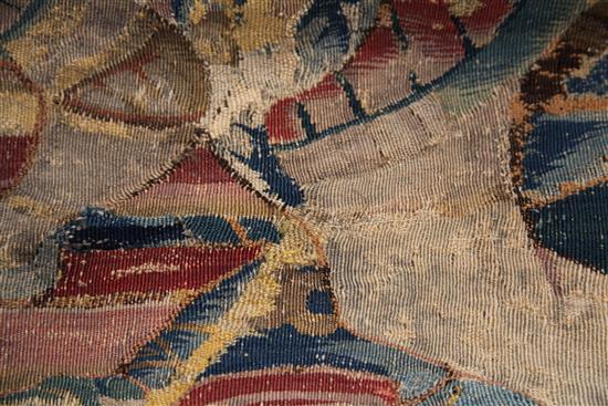 A 17th century tapestry fragment, W.3ft 4in. H.4ft 9in.